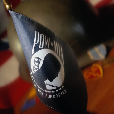 A POW/MIA flag on a desk