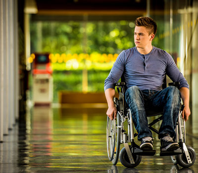 photograph of a man in a wheelchair