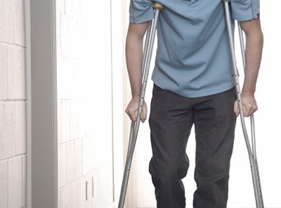 Picture of a man on crutches