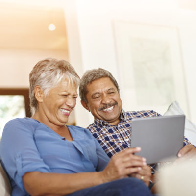 A couple watching a video on a tablet device