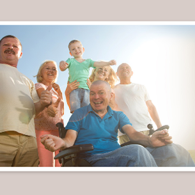 People of many different ages smiling at the camera