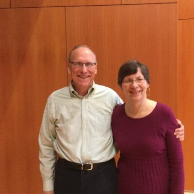 A woman and husband posing for a picture