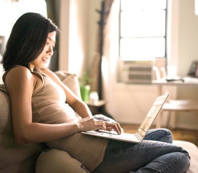 A woman using a laptop at home