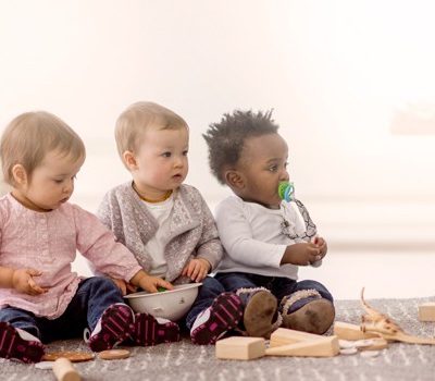 Three babies sitting together