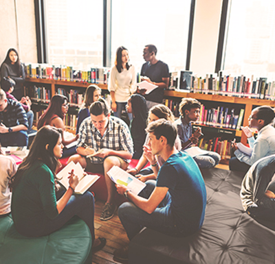 A group of students reading in a library