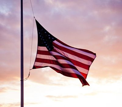 An American flag being flown at half-mast