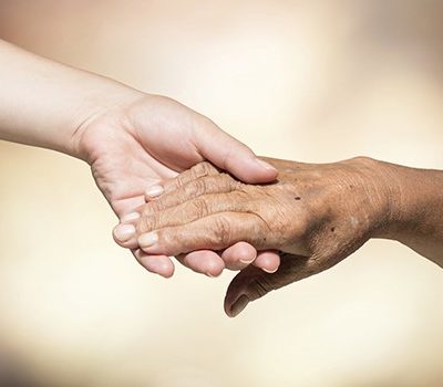 Two people of holding hands.