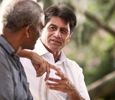 Two older men having a discussion