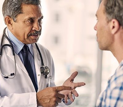 A doctor having a discussion with a man