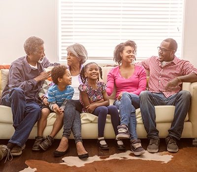 A family sitting on a couch together