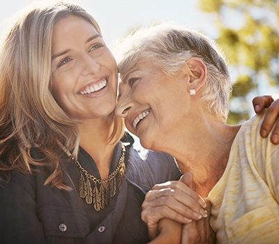 Two women smiling together