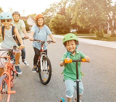 A family riding bikes in a neighborhood