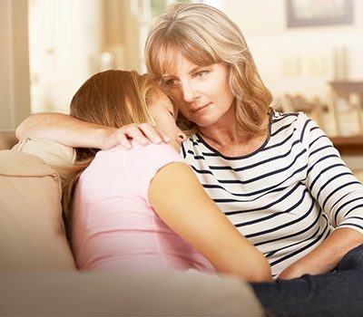 A woman comforting her daughter