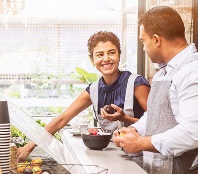 A couple cooking together in a kitchen