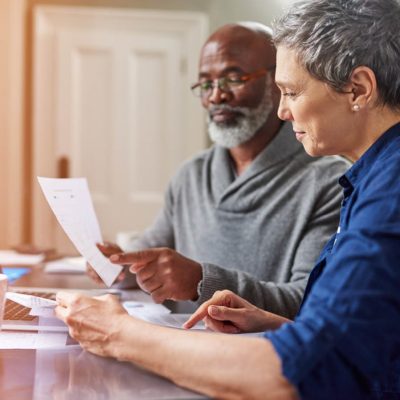 An older couple reviewing a social security benefit statement