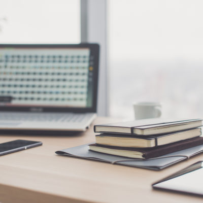 Documents on office table with pen and digital tablet as work space business concept.