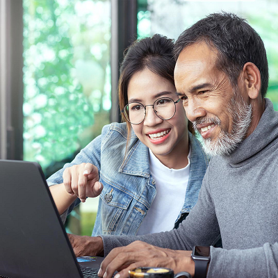 couple viewing information on a laptop together