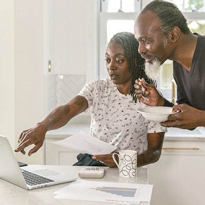 Senior couple reviewing information online