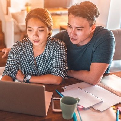 young couple reviewing information online