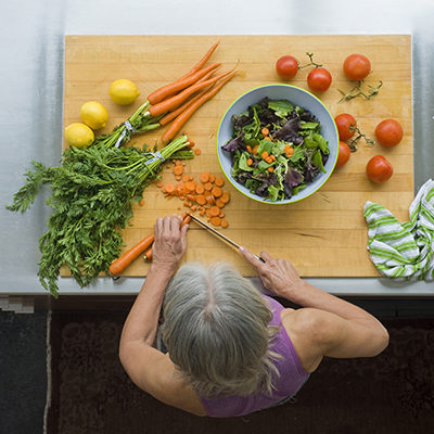 overhead view, woman making salad