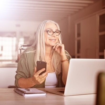 woman reviewing items on a laptop