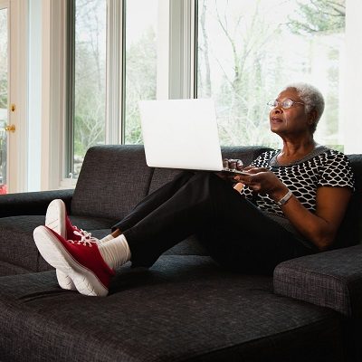 Senior woman working on laptop computer