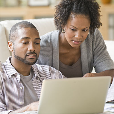 Couple using a laptop