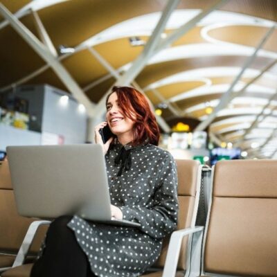 Woman on train with laptop